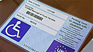 A blue badge in a car windscreen