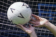 Goalkeeper catching a football