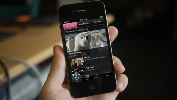 Hand holding iPhone running iPlayer