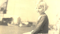 Maggie Gee sitting on the edge of Poole quay circa 1953 (photo credit Victor Gee)