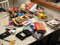 Packing for holiday could you spot the passport among the mess on this table?