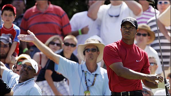 Tiger Woods hits a wayward drive