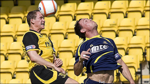 Livingston's Michael O'Byrne beats Jim Lister of Alloa to the ball 