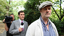 Tony Ward (Tim McInnerny, right) tells a reporter (John Hollingsworth) about his manure protest