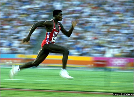 American athlete Carl Lewis wins the first of his four Olympic long jump titles at the 1984 Los Angeles Games
