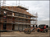 Building surrounded by scaffolding