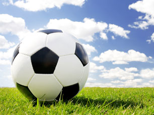 Football on grass (Image: Rene Mansi/iStockphoto)