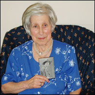 Laura with a photograph of Miss Harder