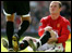 Wayne Rooney injured, sitting on the pitch 