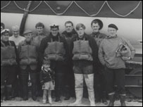Robert Oliver standing in front of his father Raymond
