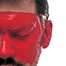 Violence in red - male face splashed with red paint