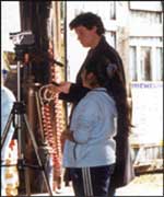 Sixth formers at Stoke Park school teach primary school children from Stoke Primary how to use video cameras 