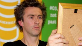 Dallas looks into a mirror