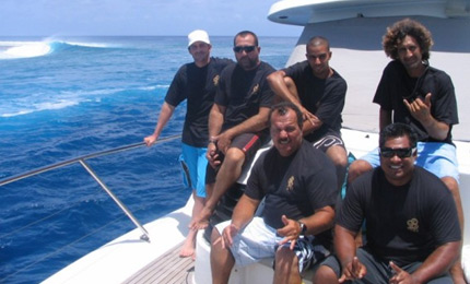 Quare boys. The Cannon Beach crew pose for the camera, but the real star of the show is yon Tahitian left hander peeling 100 yards over their shoulders. Pic courtesy George Kindley 07