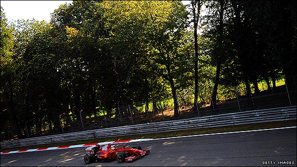 Giancarlo Fisichella glides through woods which surround the Monza circuit
