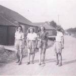 Marion Gardner on left of group of Land Army Girls about to hoe onions