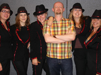 John Rockley posing with the Full Monty Girls!