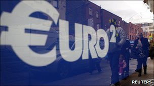 Euro reflection in window