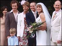 The bride and groom with her family.