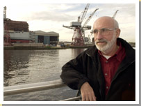 David Torrance in front of BAE Systems, once Fairfield's. 