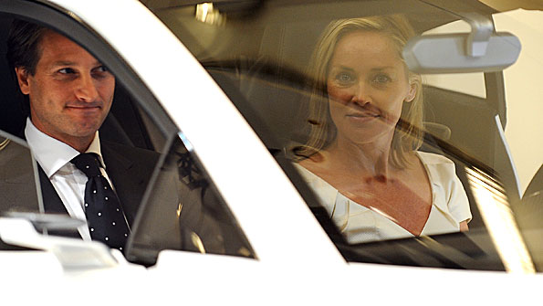 Lotus Cars CEO Dany Bahar and Hollywood actress Sharon Stone at the Paris Motor Show