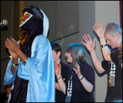 Etran Finatawa perform with pupils from Headland School