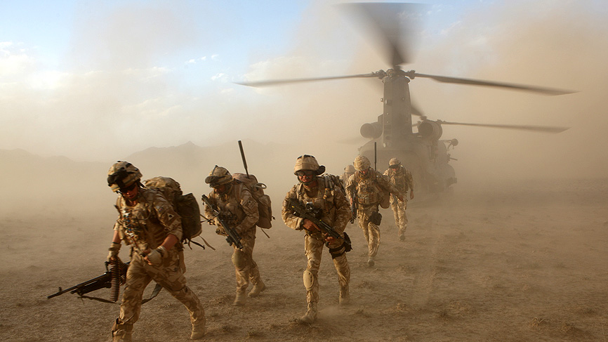 running off the back of the helicopter ramp in the grey pre-dawn light