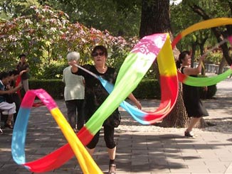 Women practicing a ribbon dance.