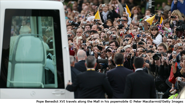 Pope Benedict XVI travels along the Mall in his popemobile to attend a prayer vigil in Hyde Park on 18 September 2010 