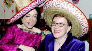 Liz and Jo smiling in sombreros