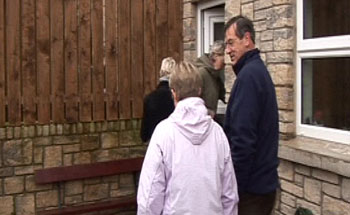 Tired of the rain, the team head inside