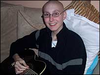 Matthew Fletcher playing guitar.