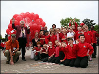 Pupils with a group of balloons