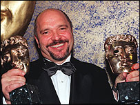 Anthony Minghella with a pair of Baftas