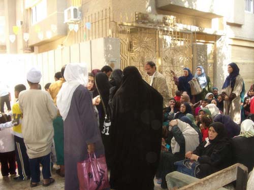 Crowd of people waiting for the Qurbani meat