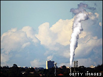 A smoke stack emitting fumes