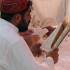 Man at prayer for Benazir Bhutto