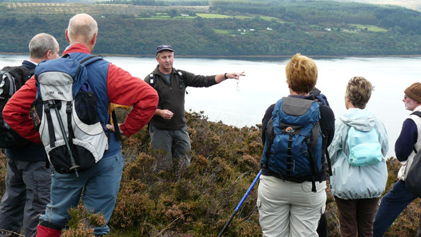 Howard Woods gives a lecture to a group of walkers