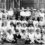 This is my class at Gopsall St school,taken I think about 1936,our teacher was Miss Harris,I am standing 5 children away from Miss Harris.
