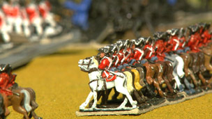 Lines of toy cavalry soldiers.