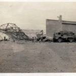 Once proud hangers of ‘Musso’ at El Adem, aerodrome showing some of the wrecked buildings after the bombing of the RAF and knocking about by the eighth army.