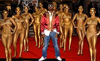 Kanye West on the red carpet with his dancers