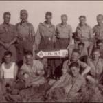 Photograph taken at first stop after breakout from Beachhead. Myself fourth from left, back row, driver Sammy Samuel at the front bottom of the picture, he and I lived in our dugout on the beachhead, from January until the breakout in June 1944.