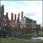 The jack with blocks of stone to act as a counterbalance.