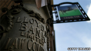 An antique Lloyds Bank sign is displayed outside a branch in Fleet Street