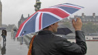 People in rain on Westminster Bridge