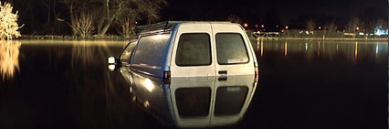 A panel-van submerged in flood waters