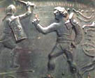 A vase showing two gladiators fighting