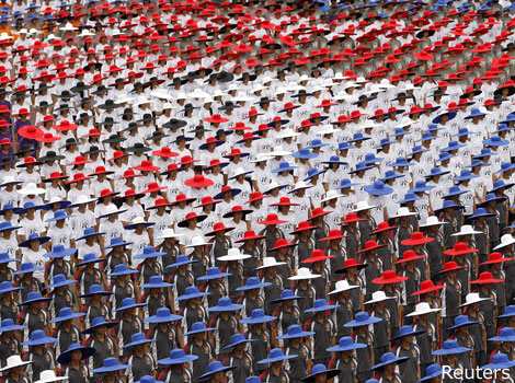 People wearing red, blue and white hats during Taiwan's National Day celebrations.