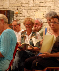 Carol and choir in rehearsal.